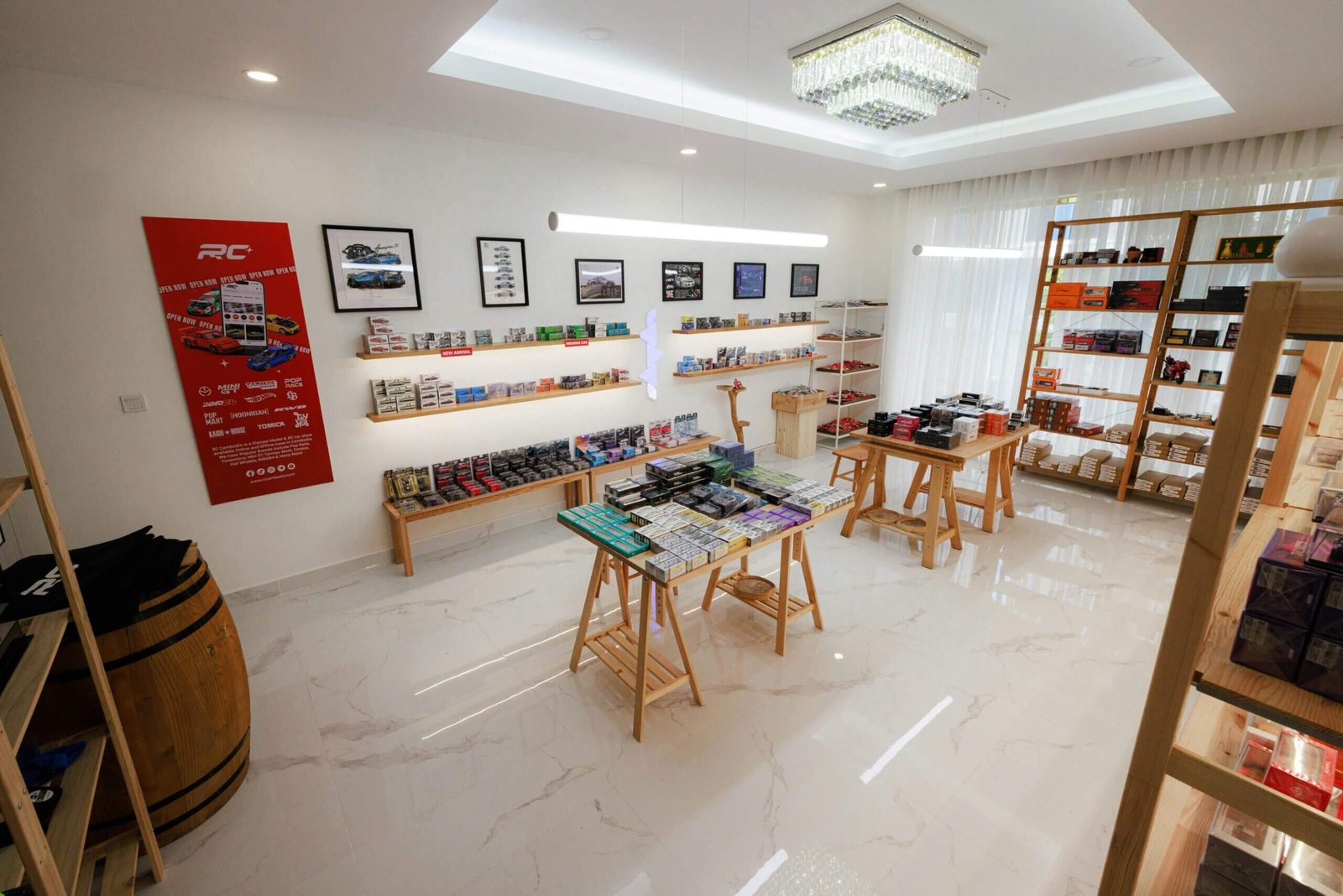 Bright and modern RC model store interior featuring wood furniture and diecast models in Phnom Penh.